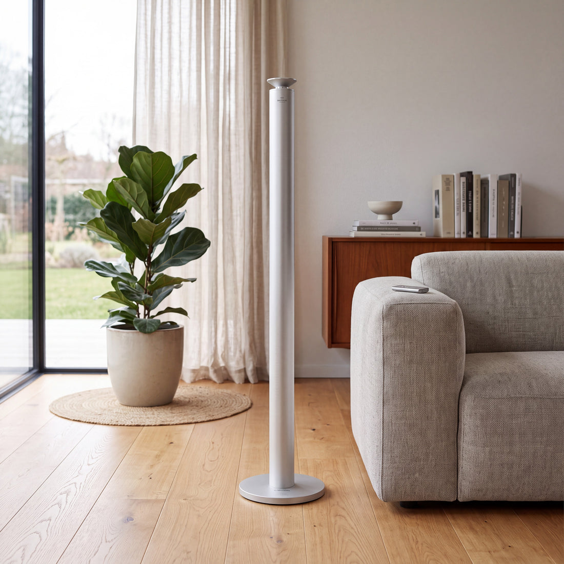 Aroma Max Mini Plus silver cold-air scent diffuser standing on the floor in a modern living room